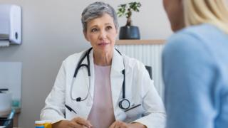A GP with a patient
