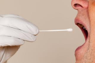 Man having a saliva DNA test