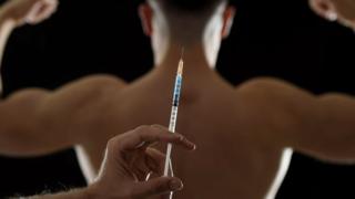 Steroid abuse - needle with man