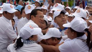 Hun Sen hugs supporters at a campaign rally on 7 July