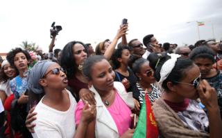 Eritreans wait to welcome their families at Asmara International Airport aboard the Ethiopian Airlines ET314 flight in Asmara, Eritrea July 18, 2018.