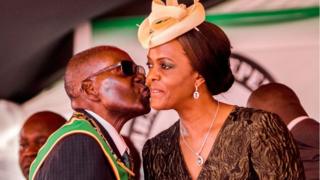President Robert Mugabe kisses his wife and first lady Grace Mugabe during during the country's 37th Independence Day celebrations at the National Sports Stadium in Harare April 2017