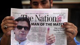 A Pakistani newspaper with a picture of Imran Khan, head of Pakistan Tehrik-e-Insaf (PTI) political party, a day after general elections in Karachi, Pakistan, 26 July 2018