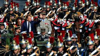 President Macron rides with the French army chief of staff