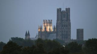 Clouds over Ely Cathedral in Cambridgeshire obscuring a view of the blood moon