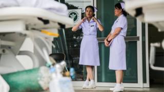 Nurses pictured outside of Chiangrai Prachanukroh Hospital,