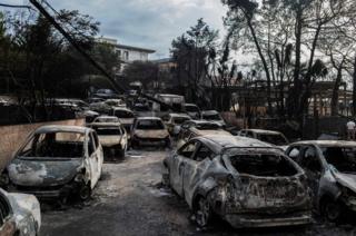 This photo show cars burnt following a wildfire at the village of Mati.