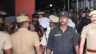 Police stand guard as the accused are brought to court in Chennai, India, July 17, 2018