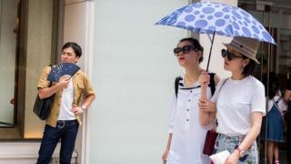 Tokyo residents braving the heat