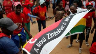 Opposition Movement for Democratic Change (MDC) party supporters wave flags at a rally to launch their election campaign in Harare, Zimbabwe, January 21, 2018.