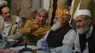Pakistani opposition leader Maulana Fazalur Rehman (2nd R) and Shahbaz Sharif (2nd L), younger brother of Nawaz Sharif, attend an All Parties Conference in Islamabad on July 27, 2018