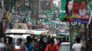 A street is decorated with flags and banners of political parties ahead of a general election in Rawalpindi, Pakistan, July 23, 2018