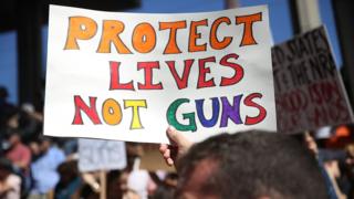 A sign protesting gun violence in the US