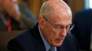 US Director of National Intelligence Dan Coats listens with his head down during a cabinet meeting at the White House in Washington