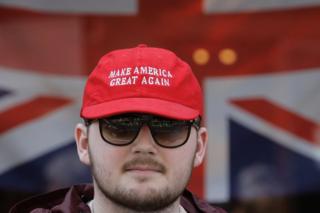 A pro Donald Trump supporter is seen outside Windsor Castle in Windsor