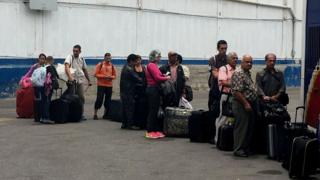 A queue of people getting ready to leave Venezuela