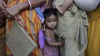 An ethnic violence affected child looks on at a relief camp at Bhot Gaon village in Kokrajhar, Assam state, India, Wednesday, July 25, 2012.