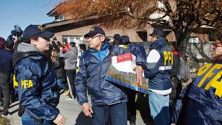 The Argentine Federal Police (PFA) takes part in a raid at the house of former Argentine President and current senator Cristina Fernandez de Kirchner in Rio Gallegos, Santa Cruz Province, in southern Argentina,