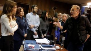 Protesters from the Communist-affiliated trade union PAME argue with Greek Labour Minister Effie Achtsioglou (L), 9 Jan 18