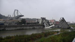 Wide shot shows large sectiosn of bridge collapsed, with remaining part exposed