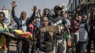Supporters of Zimbabwean opposition MDC Alliance take part in a protest in Harare over alleged fraud in the country's election, 1 August 2018