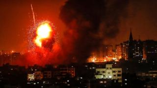 A picture taken on August 8, 2018 shows a fireball exploding during Israeli air strikes in Gaza City.