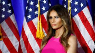 This file photo taken on June 06, 2016 shows Melania Trump, wife of Republican presidential candidate Donald Trump, listening as her husband delivers remarks at Trump National Golf Club Westchester in Briarcliff Manor, New York.