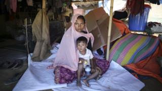 Sabikul Nahar poses for a photo with a kid at a refugee camp in Cox's Bazar, Bangladesh on December 19, 2017