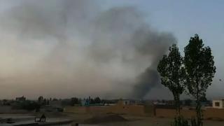 Smoke rises into the air after Taliban militants launched an attack on the Afghan provincial capital Ghazni