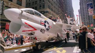 A Navy jet is pulled down Broadway Avenue in a June 1991 welcome home parade for returning Gulf War troops