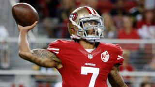 Colin Kaepernick throws a ball during a game