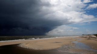 Storm clouds loom over a beach as Tropical Storm Gordon approaches Waveland, Mississippi. Photo: 4 September 2018