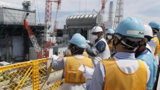 Journalists pictured at the Fukushima nuclear power plant
