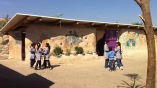 Bedouin children are taught at Khan al-Ahmar school