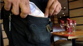 Worker with money pouch