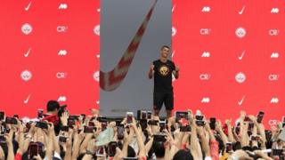 Cristiano Ronaldo gestures as fans take photos of him, during an event held by Nike. File photo