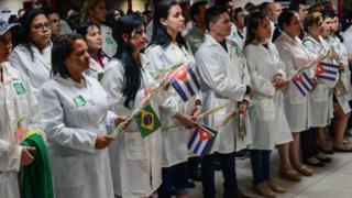 Cuban doctors at welcome ceremony at Havana airport after return from Brazil - 23 November