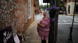 Susan Bro, mother of Heather Heyer, who was killed during the August 2017 white nationalist rally in Charlottesville, stands at the memorial at the site where her daughter was killed in Charlottesville, Virginia, U.S., July 31, 2018.