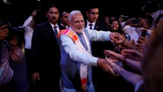 Indian Prime Minister Narendra Modi greets attendees at the Peace through Yoga meeting in Buenos Aires, Argentina, November 29, 2018