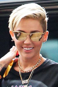 Miley Cyrus shows how undercuts can really work on cropped hair. Pile your hair to one side when you want to show it off or part it the other side when you don ’t!