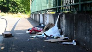 Trash left behind on a street in Portland