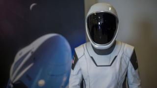 A spacesuit designed for use on the Crew Dragon spacecraft is seen during a media tour of SpaceX headquarters and rocket factory on August 13, 2018 in Hawthorne, California.