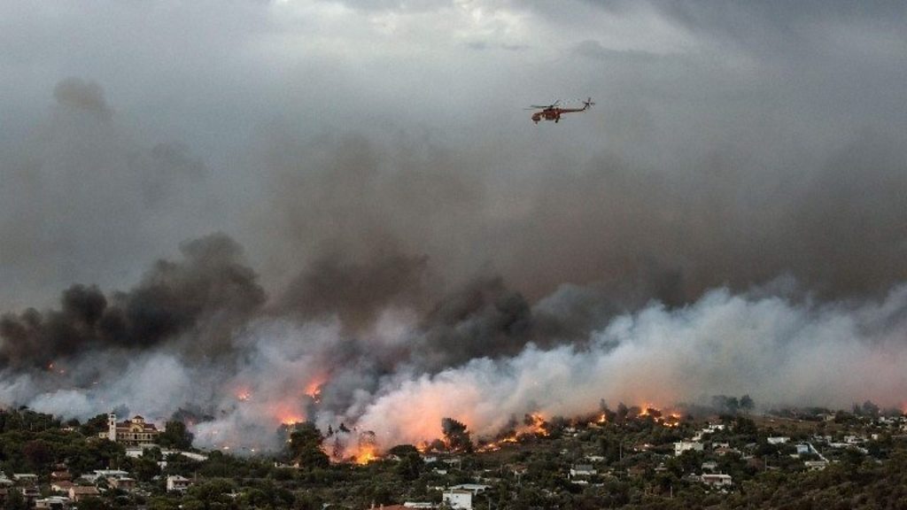 Greece wildfires: no less than 74 lifeless as blaze 'struck like flamethrower'