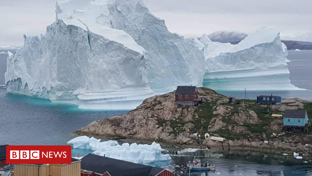 Massive iceberg threatens Greenland village