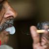 Hand Over-smoking helpline number on India cigarette packs