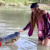 Texas pupil poses with alligator in commencement snaps