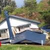 Dozens missing after strong Japan earthquake and mudslides