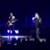 U2's Bono cuts brief Berlin show after dropping voice