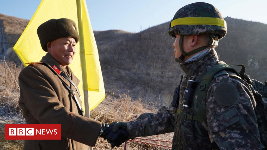 North and South Korea infantrymen pass DMZ in peace