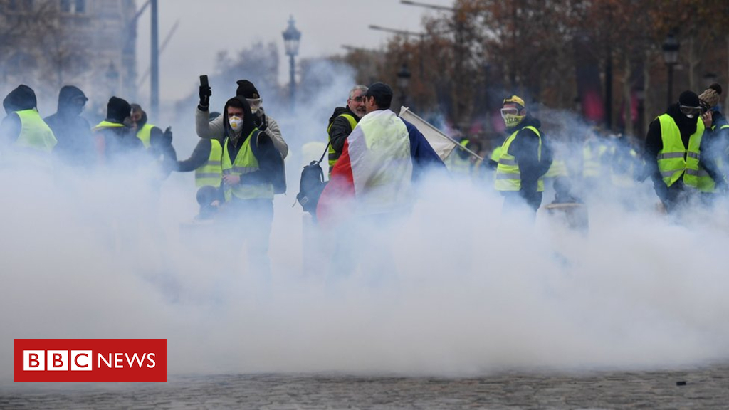 France gasoline protests: Tear fuel fired in clashes in Paris